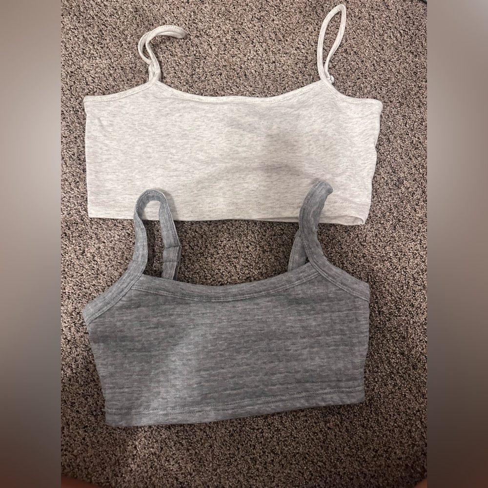 two gray tank tops/ bras